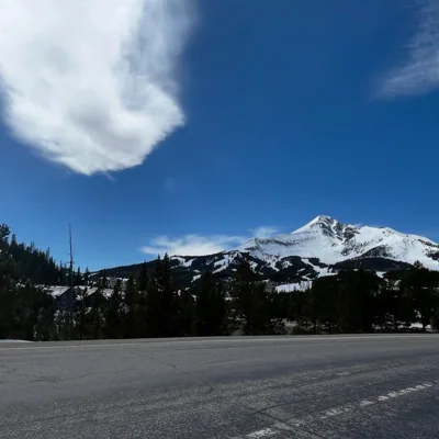 A mountain rises beyond a quiet road.