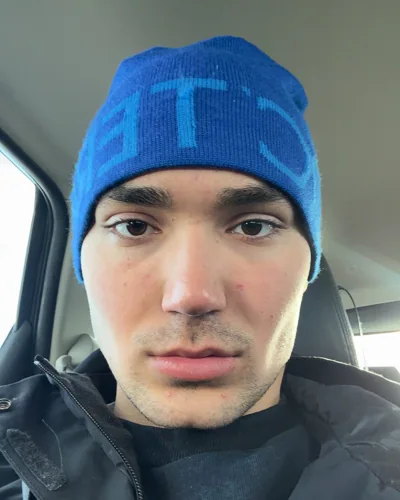 A close portrait in a blue beanie.