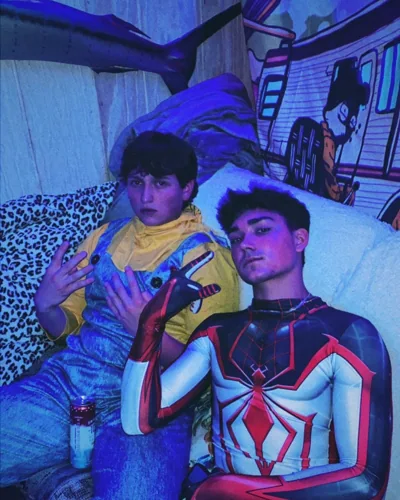 A photograph with a friend while wearing a Spider-Man costume.